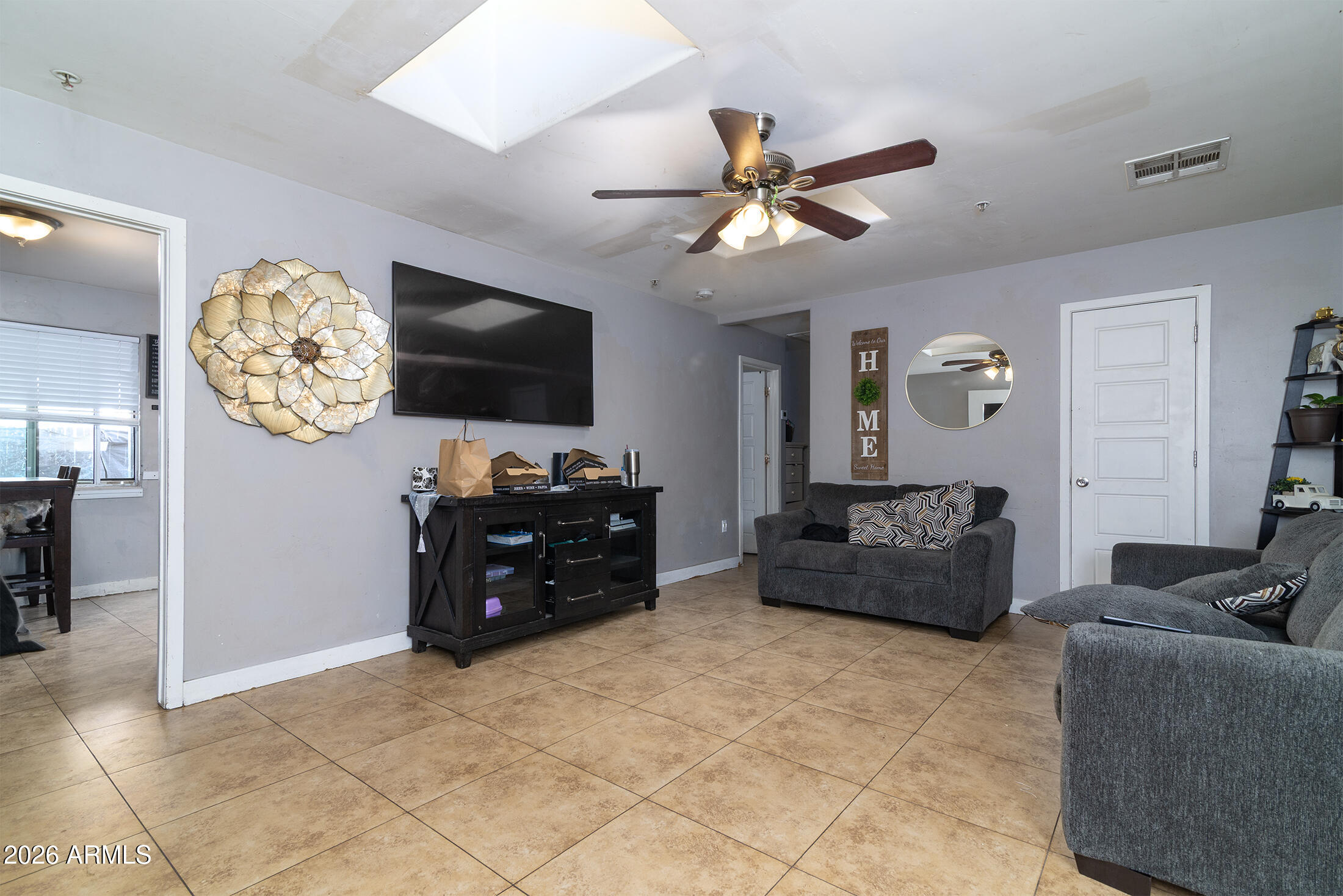822 East Montecito Avenue Phoenix, AZ 85014 - Photo 30 of 48 a living room with furniture and a flat screen tv