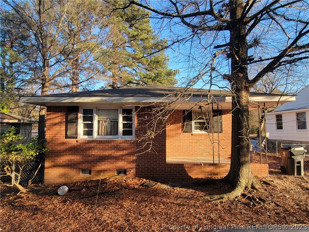 705 Eva Circle Spring Lake, NC 28390 - Photo 1 of 21 a view of a house with a tree in the yard