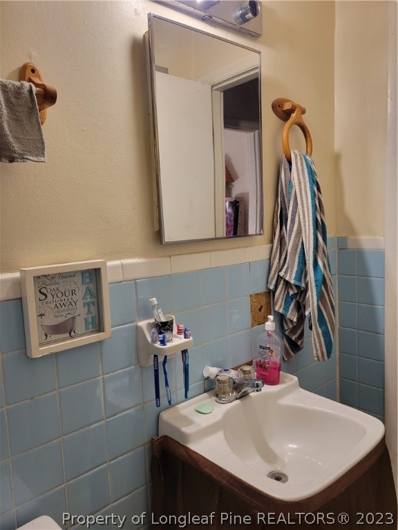 705 Eva Circle Spring Lake, NC 28390 - Photo 15 of 21 a bathroom with a sink and mirror