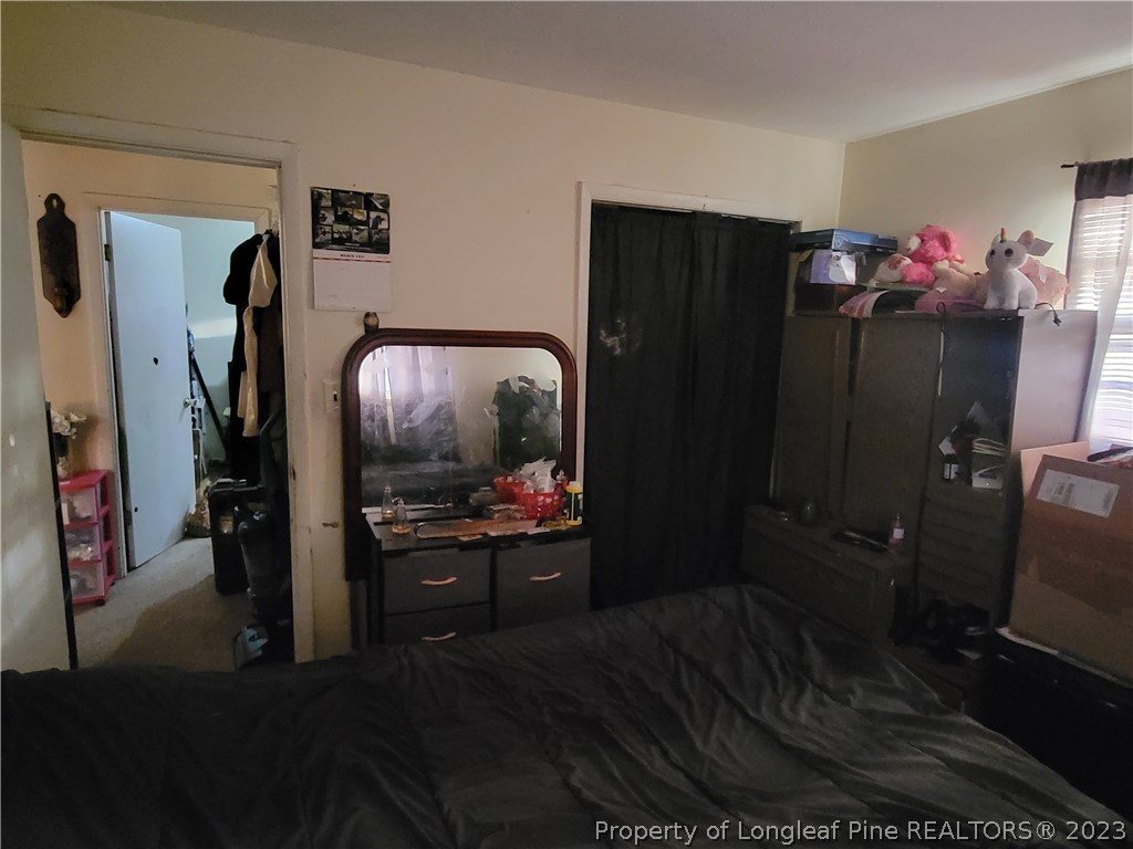 705 Eva Circle Spring Lake, NC 28390 - Photo 16 of 21 a living room with furniture and a flat screen tv