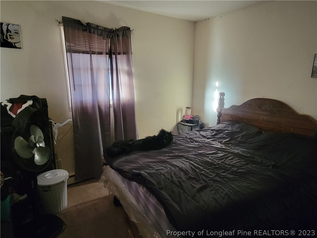 705 Eva Circle Spring Lake, NC 28390 - Photo 17 of 21 a bedroom with a bed and cabinets