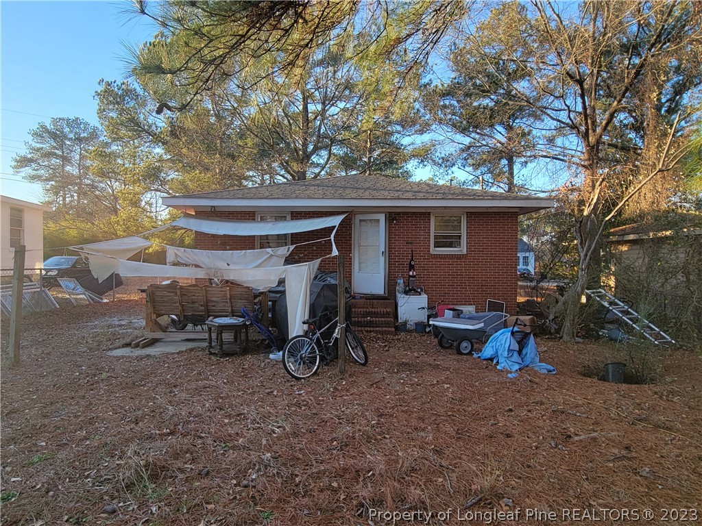 705 Eva Circle Spring Lake, NC 28390 - Photo 20 of 21 a view of a backyard with a parked car and a parked car