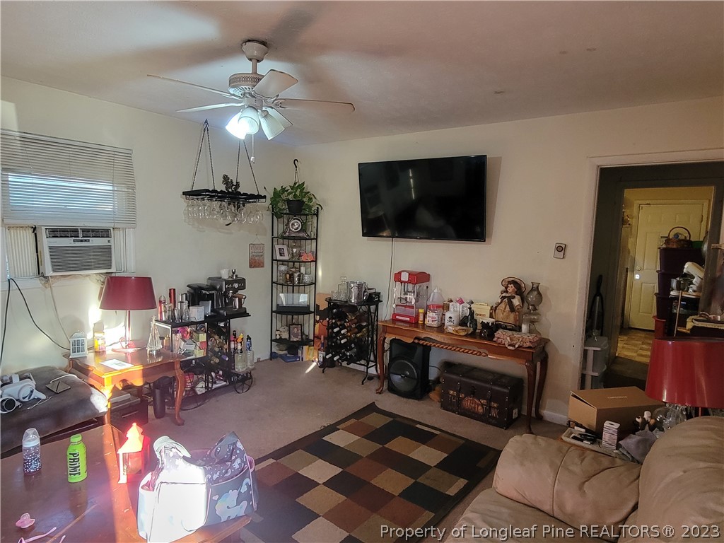705 Eva Circle Spring Lake, NC 28390 - Photo 4 of 21 a living room with furniture and a flat screen tv