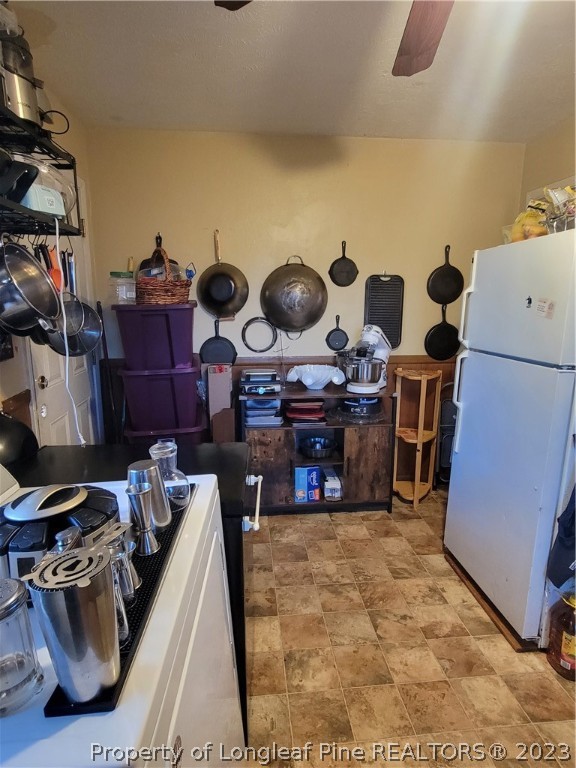 705 Eva Circle Spring Lake, NC 28390 - Photo 8 of 21 a kitchen with cabinets and stove