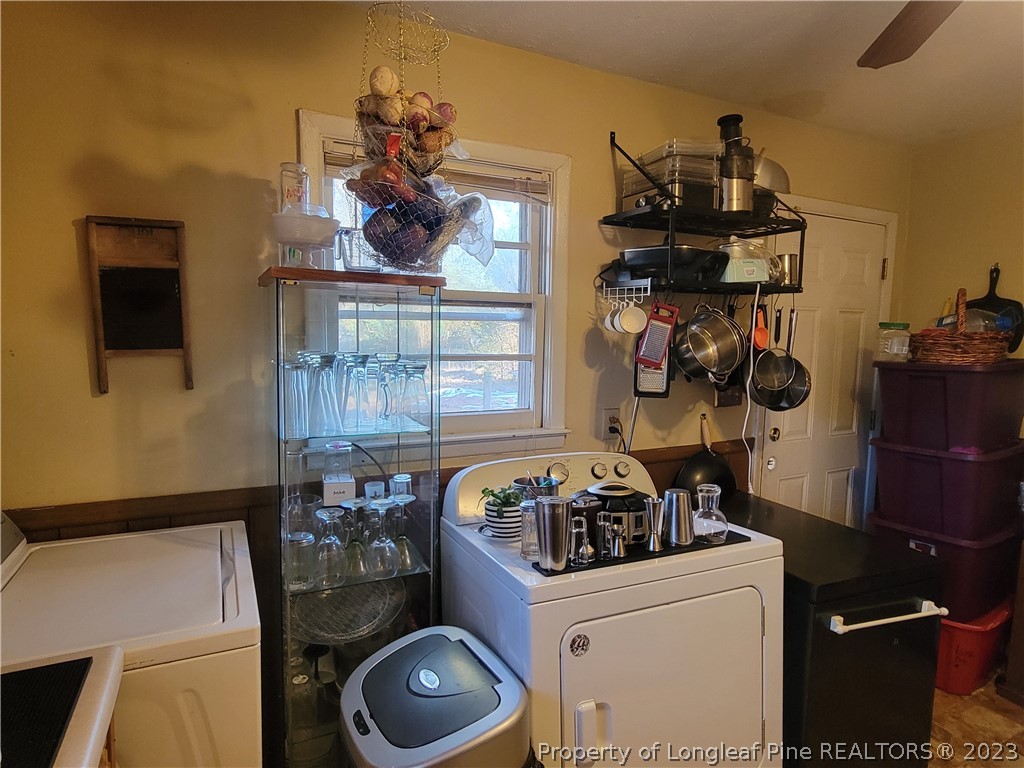 705 Eva Circle Spring Lake, NC 28390 - Photo 9 of 21 a kitchen with a stove and a refrigerator