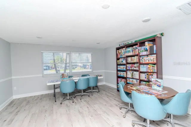 a view of pool with lawn chairs and a big yard