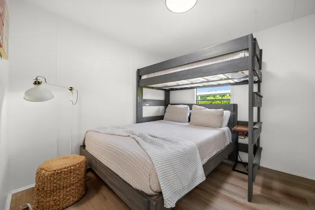 a bedroom with bed and window