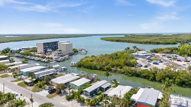 an aerial view of a house with a lake view