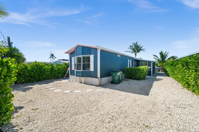 a view of a backyard with a patio
