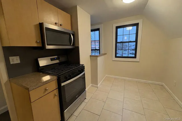 a kitchen with a stove and a microwave