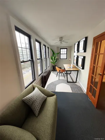 a living room with furniture and a window