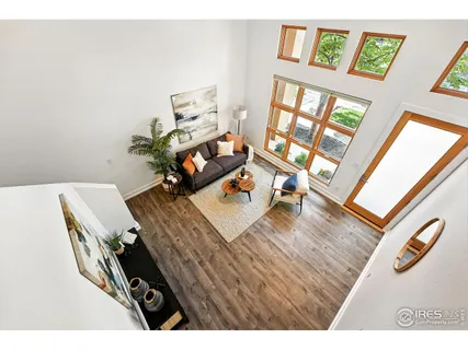 a bedroom with a large bed and a night stand