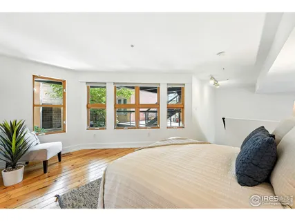 a living room filled with furniture and a large window