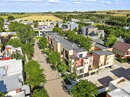 an aerial view of residential houses with outdoor space