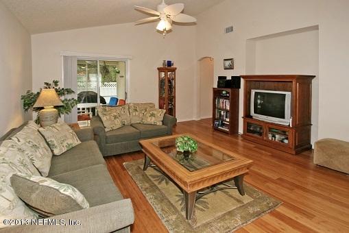 1825 Keswick Road St. Augustine, FL 32084 - Photo 8 of 19 a living room with furniture and a flat screen tv