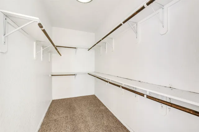 a view of a hallway with stairs