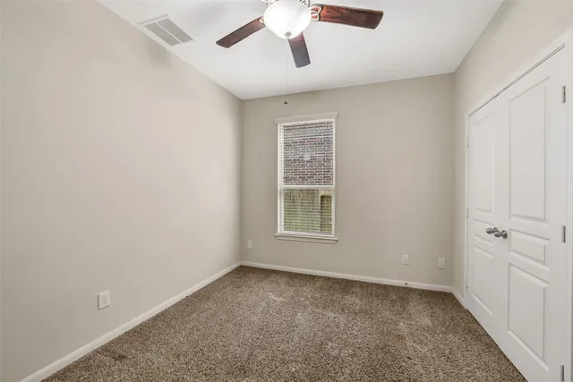 an empty room with a empty space and windows