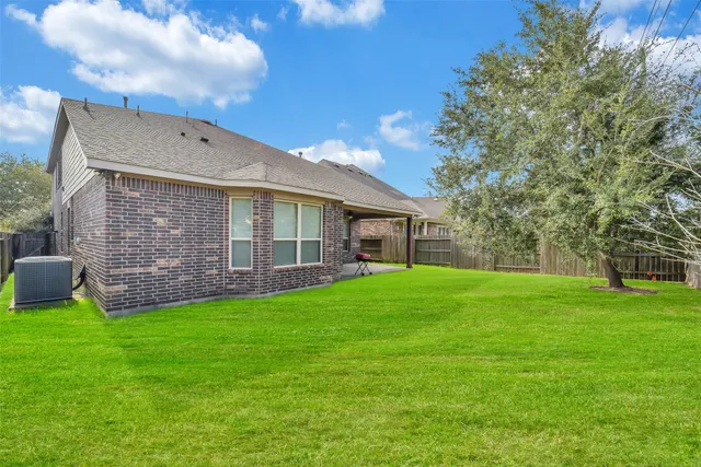 a view of a backyard of the house