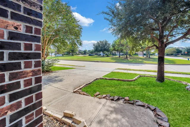 a view of a swimming pool and a yard