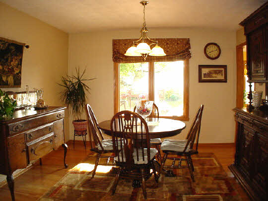 9845 Rambouillet Ridge Roscoe, IL 61073 - Photo 6 of 11 a view of a dining room with furniture window and outside view