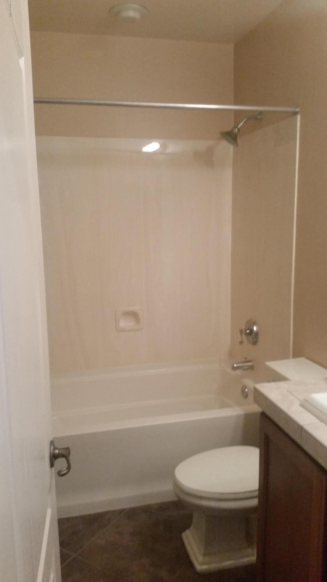 478 East Cedarvale Road Tucson, AZ 85704 - Photo 13 of 39 a bathroom with a shower a toilet and a sink