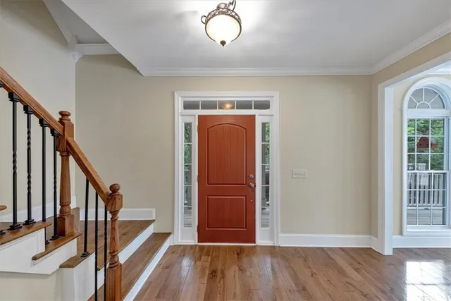a kitchen with stainless steel appliances granite countertop a refrigerator and a stove