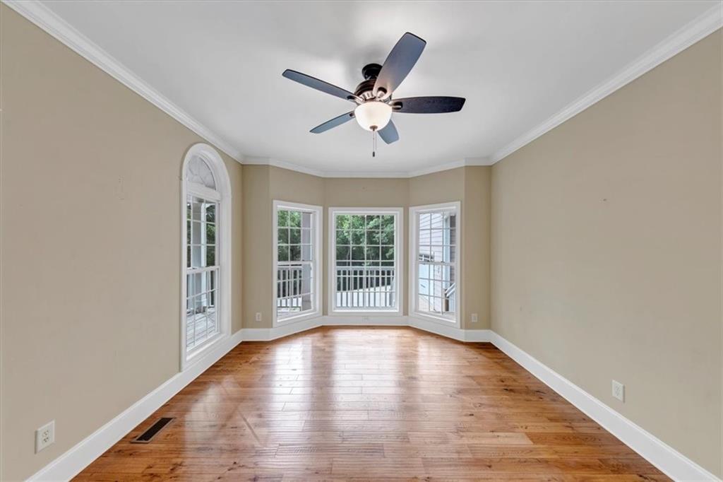 231 Beaver Ridge Road Jasper, GA 30143 - Photo 15 of 80 a view of empty room with wooden floor and fan