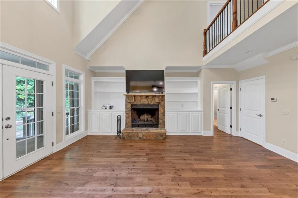 231 Beaver Ridge Road Jasper, GA 30143 - Photo 20 of 80 a view of an empty room with a fireplace and a window