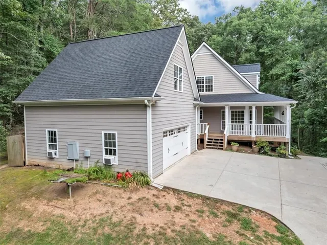 a view of a wooden deck next to a yard