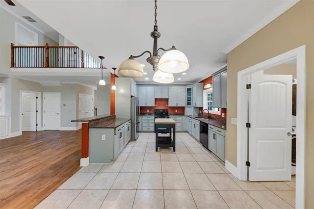 a view of an empty room and wooden floor