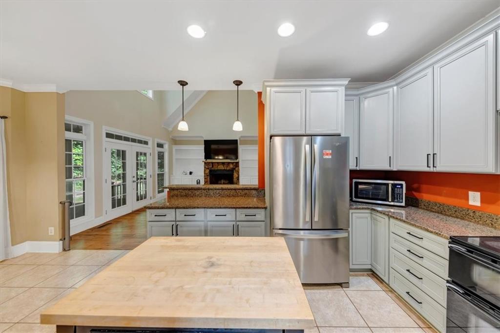 231 Beaver Ridge Road Jasper, GA 30143 - Photo 26 of 80 a kitchen with stainless steel appliances granite countertop a refrigerator and a stove