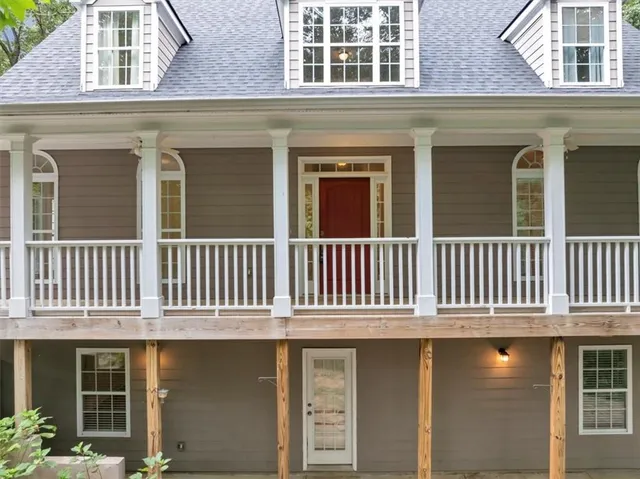 a view of balcony with wooden floor and windows