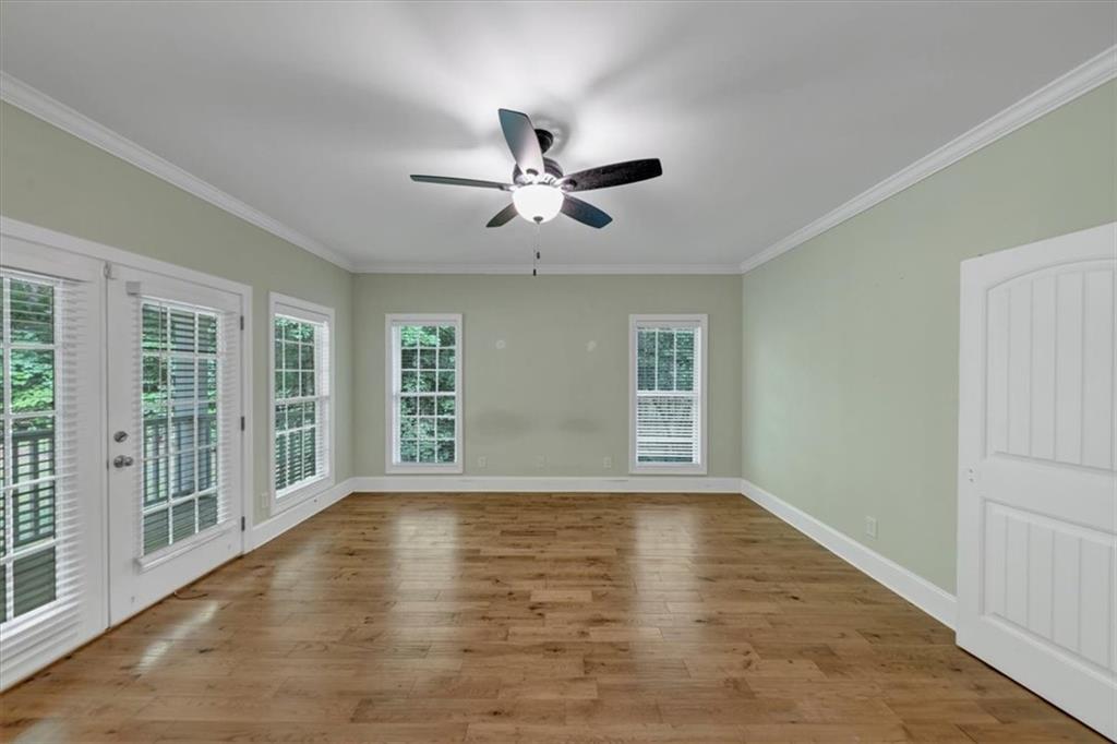 231 Beaver Ridge Road Jasper, GA 30143 - Photo 32 of 80 a view of an empty room with a window and wooden floor