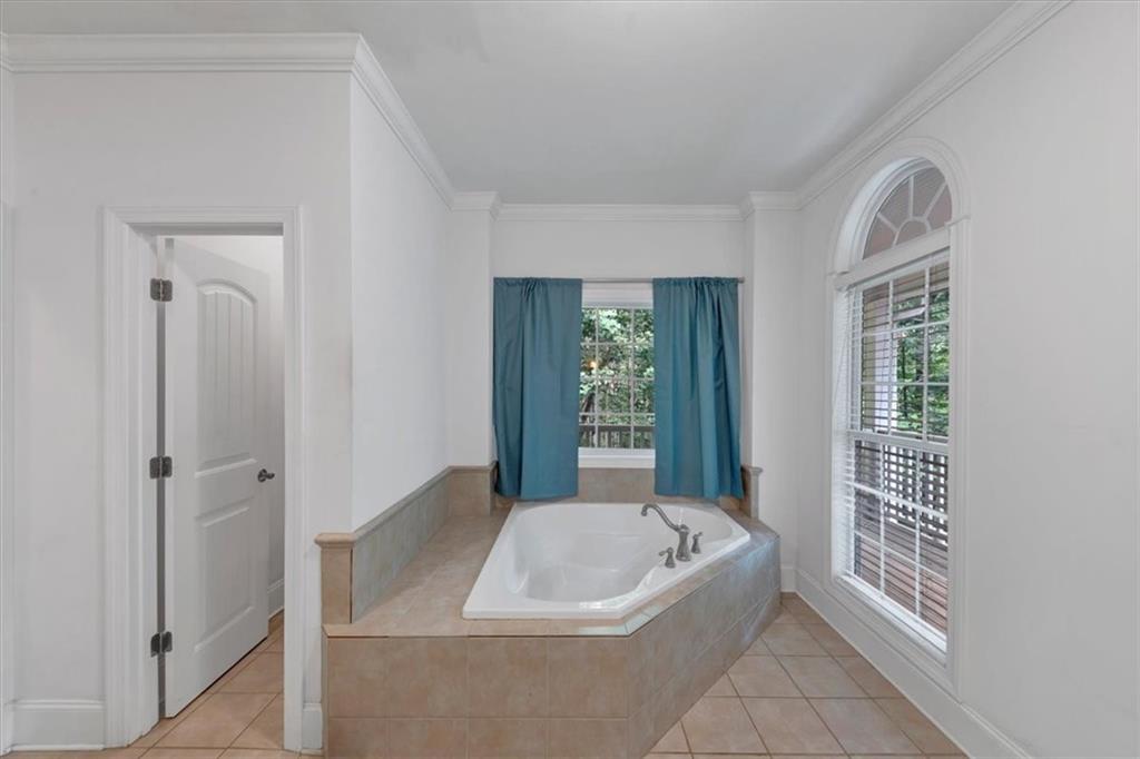 231 Beaver Ridge Road Jasper, GA 30143 - Photo 36 of 80 a spacious bathroom with a bathtub and window