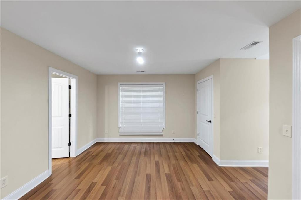 231 Beaver Ridge Road Jasper, GA 30143 - Photo 39 of 80 wooden floor in an empty room with a window