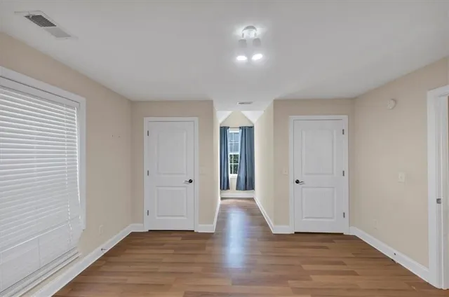 a view of wooden floor in an empty room