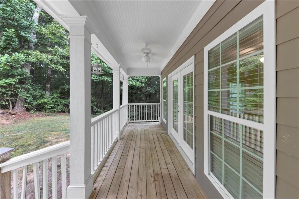 231 Beaver Ridge Road Jasper, GA 30143 - Photo 4 of 80 a view of a wooden deck next to a yard