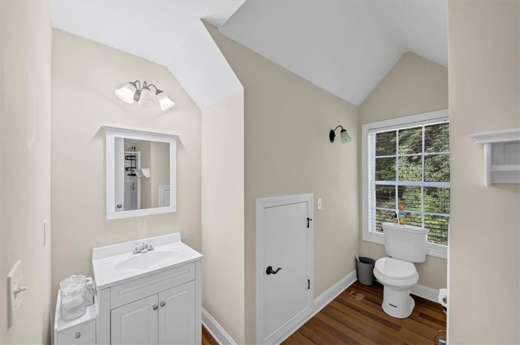 231 Beaver Ridge Road Jasper, GA 30143 - Photo 42 of 80 a bathroom with a toilet sink and mirror