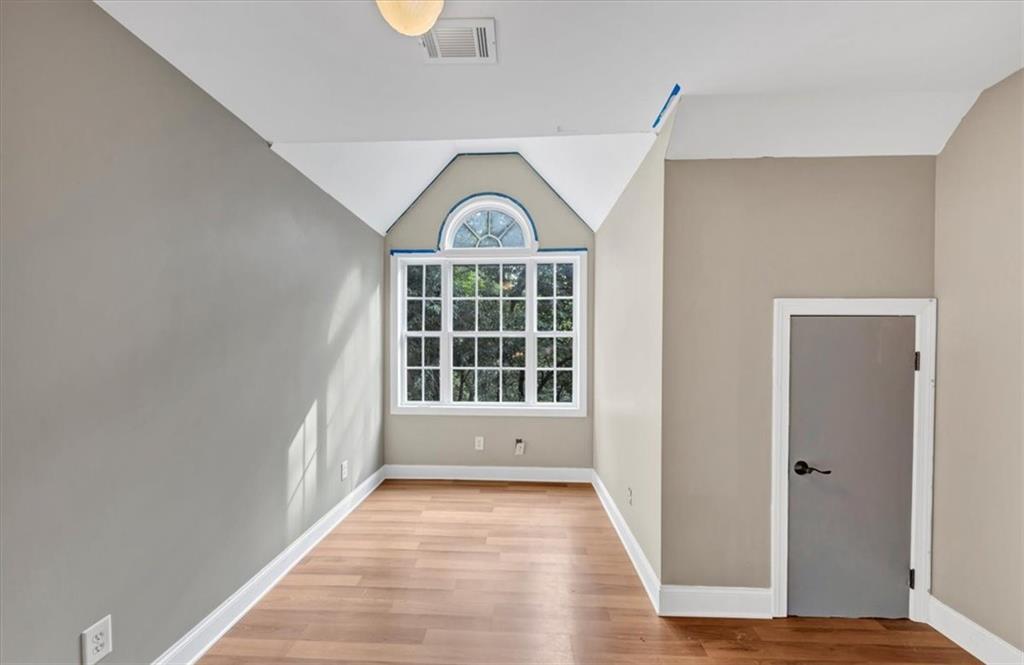231 Beaver Ridge Road Jasper, GA 30143 - Photo 45 of 80 a view of an empty room with wooden floor and a window