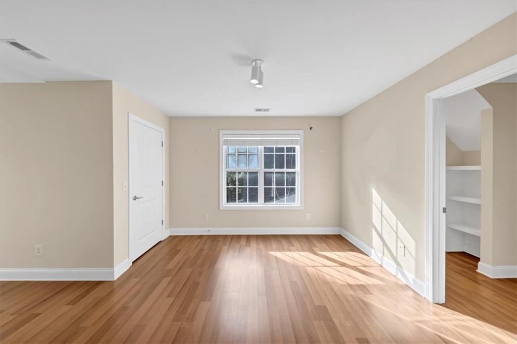 231 Beaver Ridge Road Jasper, GA 30143 - Photo 47 of 80 a view of an empty room with wooden floor and a window