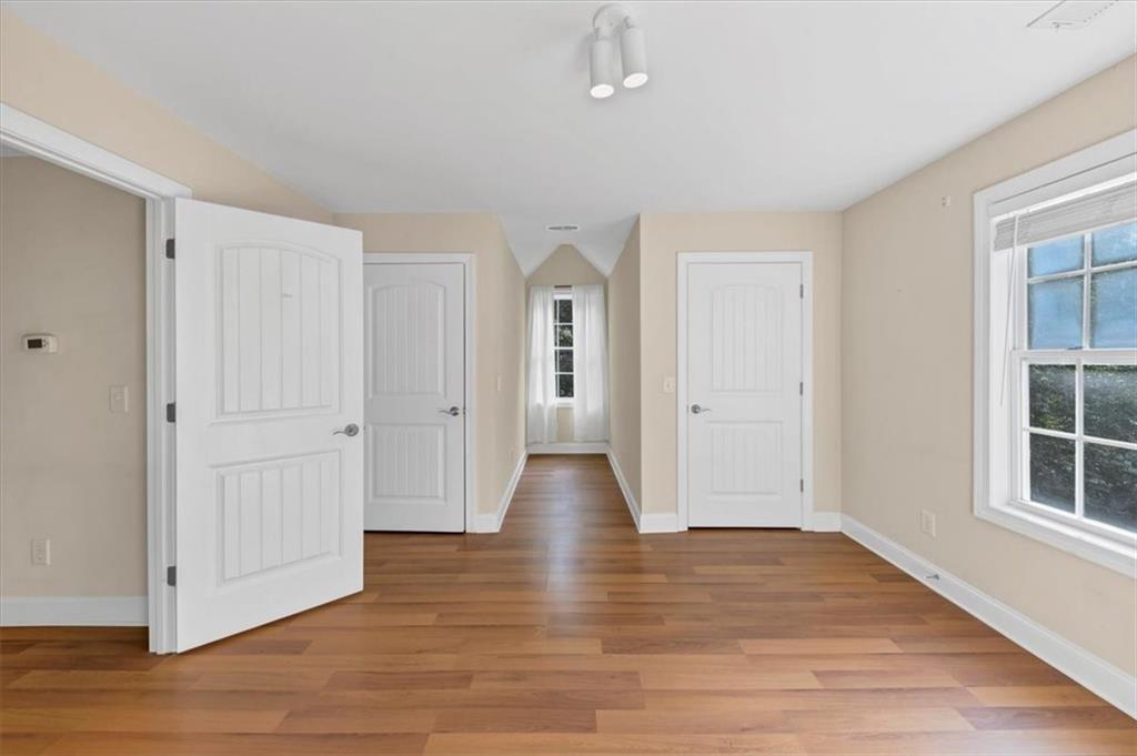 231 Beaver Ridge Road Jasper, GA 30143 - Photo 48 of 80 a view of an empty room with wooden floor and windows