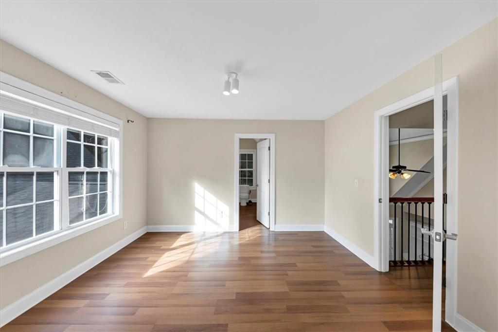 231 Beaver Ridge Road Jasper, GA 30143 - Photo 49 of 80 a view of empty room with wooden floor and fan
