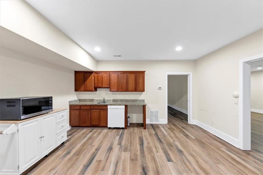 231 Beaver Ridge Road Jasper, GA 30143 - Photo 56 of 80 a kitchen with stainless steel appliances a refrigerator and a stove top oven