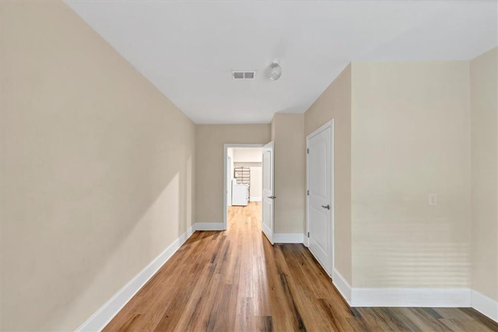 231 Beaver Ridge Road Jasper, GA 30143 - Photo 58 of 80 a view of a room with wooden floor and white walls