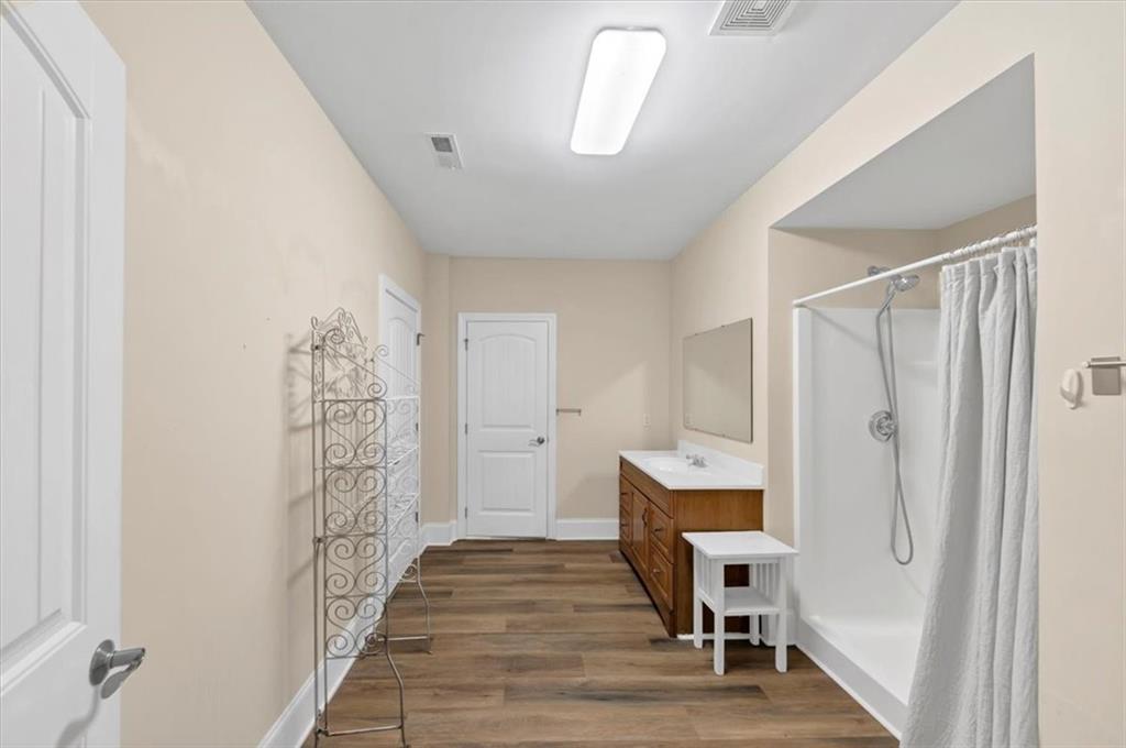 231 Beaver Ridge Road Jasper, GA 30143 - Photo 59 of 80 a room with furniture and wooden floor