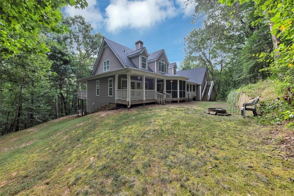 231 Beaver Ridge Road Jasper, GA 30143 - Photo 65 of 80 a view of a house with a yard and large trees