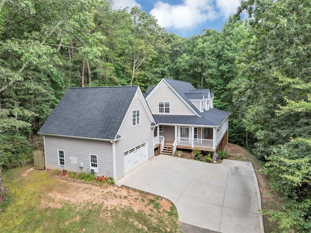 231 Beaver Ridge Road Jasper, GA 30143 - Photo 66 of 80 a front view of a house with a garden and trees