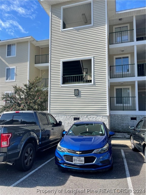 3375 Galleria Drive, Unit 17 Fayetteville, NC 28303 - Photo 1 of 19 a car parked in front of a house
