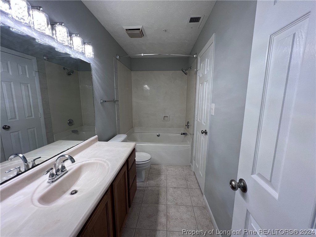 3375 Galleria Drive, Unit 17 Fayetteville, NC 28303 - Photo 11 of 19 a bathroom with a double vanity sink and a mirror
