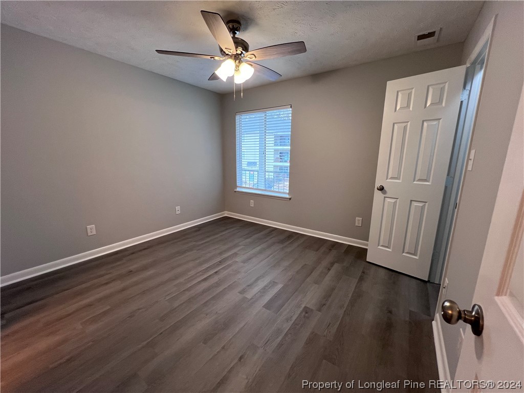 3375 Galleria Drive, Unit 17 Fayetteville, NC 28303 - Photo 16 of 19 an empty room with wooden floor and window